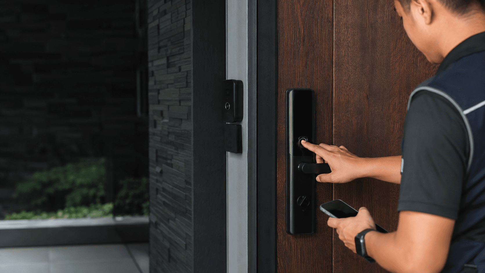 Technician commissioning a biometric smart door lock